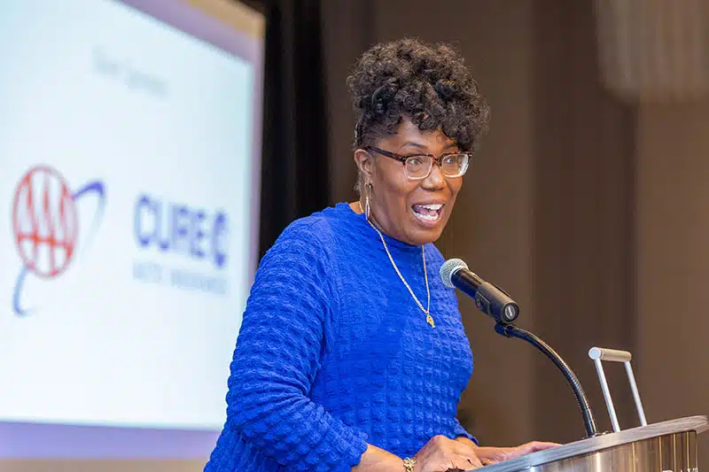 Nicole Avery Nichols, Editor of the Detroit Free Press, speaking on stage at the Detroit Free Press Breakfast Club Series at the Daxton Hotel in Birmingham, Michigan—captured in a professional event photo highlighting her leadership and journalistic expertise