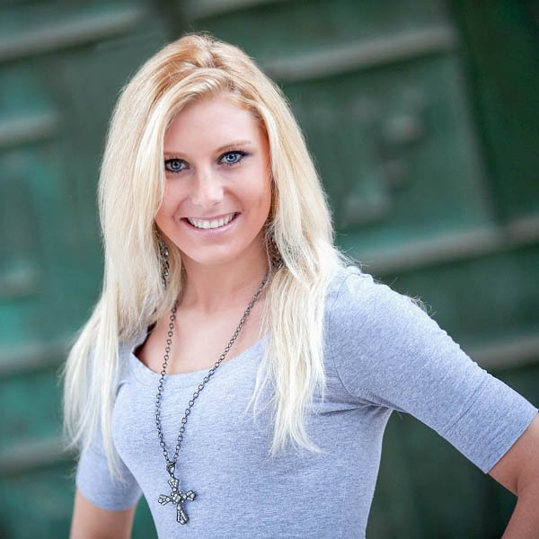 young-lady-in-front-of-green-door