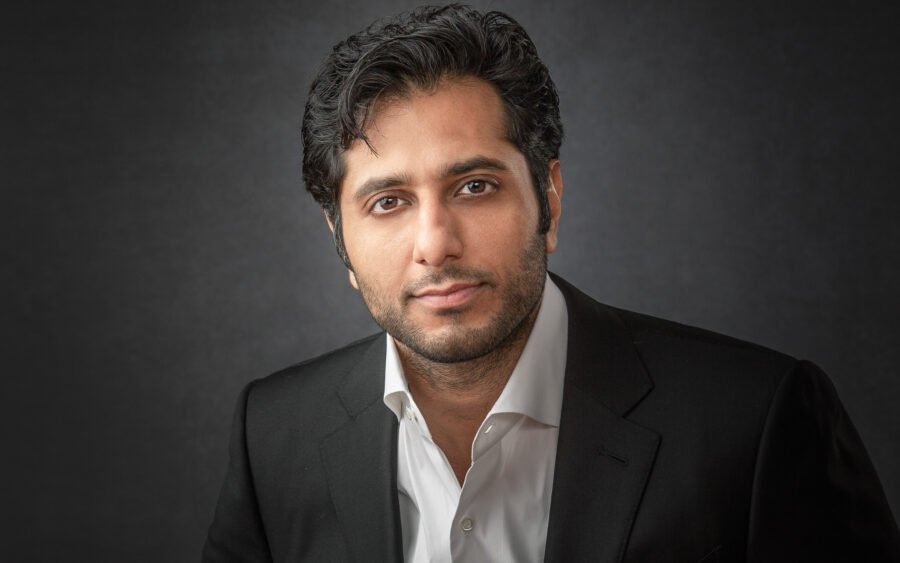 Professional headshot of a man against a studio backdrop. Taken in Bloomfield Hills, Michigan.