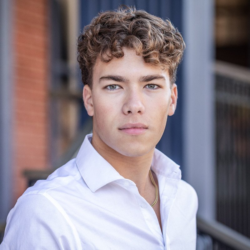 birmingham-senior-portraits Birmingham senior portrait. A senior boy photographed in the streen in Birmingham, Michigan, wearing a white shirt