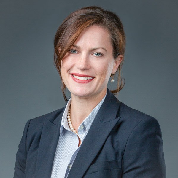 headshot-price-image-hugh-anderson-bloomfield-hills-lawyer Headshot photo of an executive lawyer in Bloomfield Hills, Michigan, a lady with a dark jacket, hair tied up, smiling at the camera