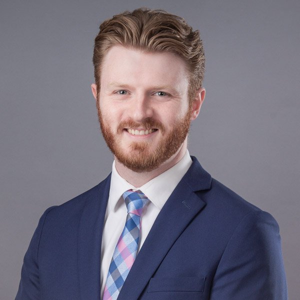 headshot-price-image-hugh-anderson-bloomfield-hills Headshot photo of an executive in Bloomfield Hills, Michigan, bearded man with a blue jacket and patterned tie.