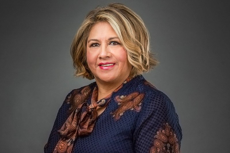 Mothers Day portrait of a middle aged woman, in a studio setting