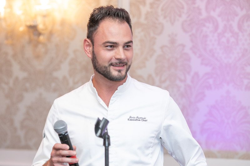 Executive chef speaking at Ally corporate dinner at Royal Park Hotel