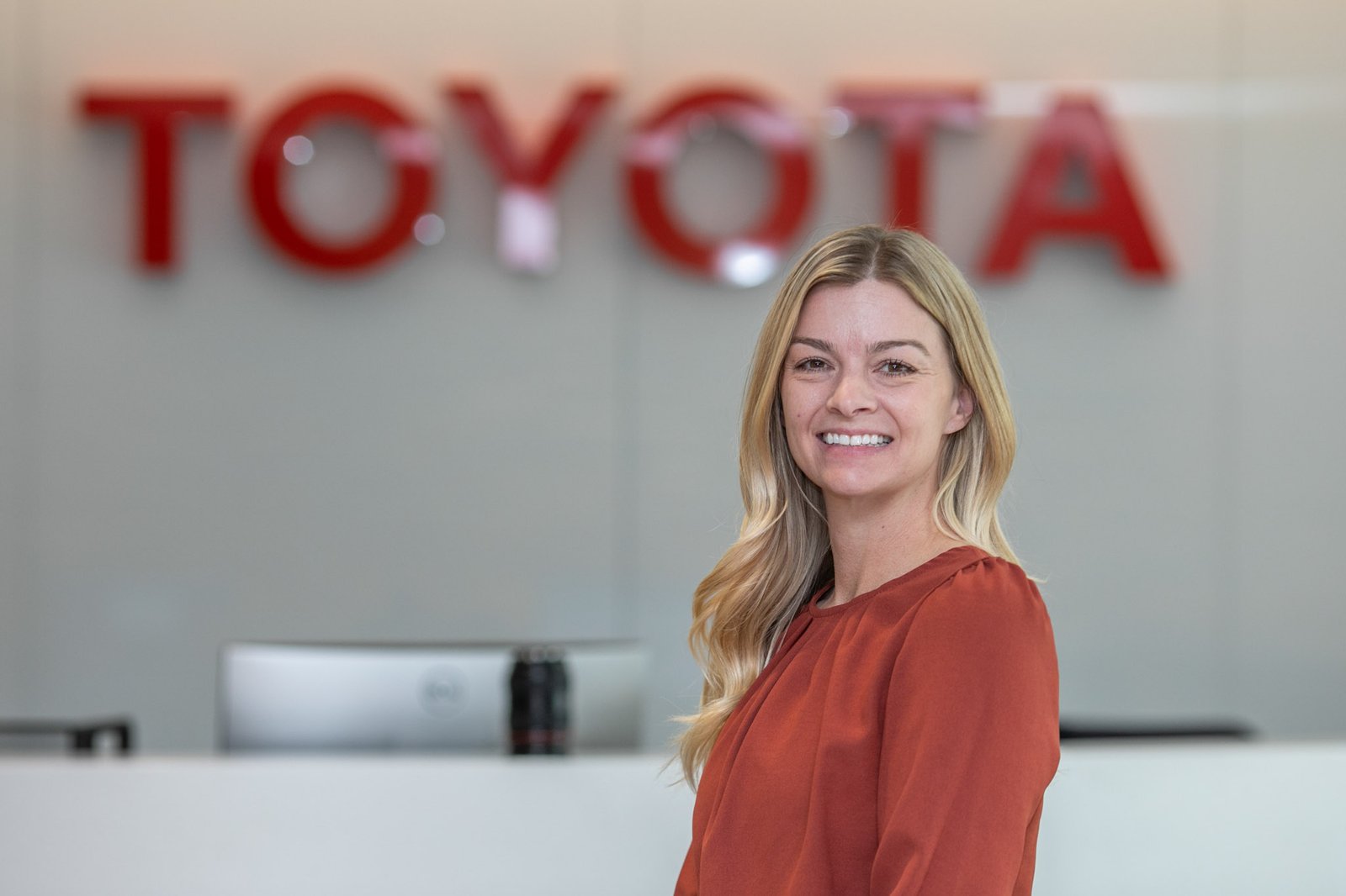Guest speaker presenting at a corporate Suppliers Partnership quarterly meeting inside an automotive conference venue in Saline, Michigan, photographed by Hugh Anderson Photography - mobile