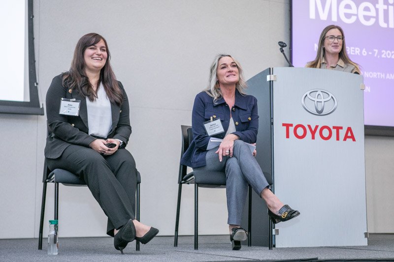 Corporate event photographer capturing a panel discussion at a Toyota-hosted conference in Michigan