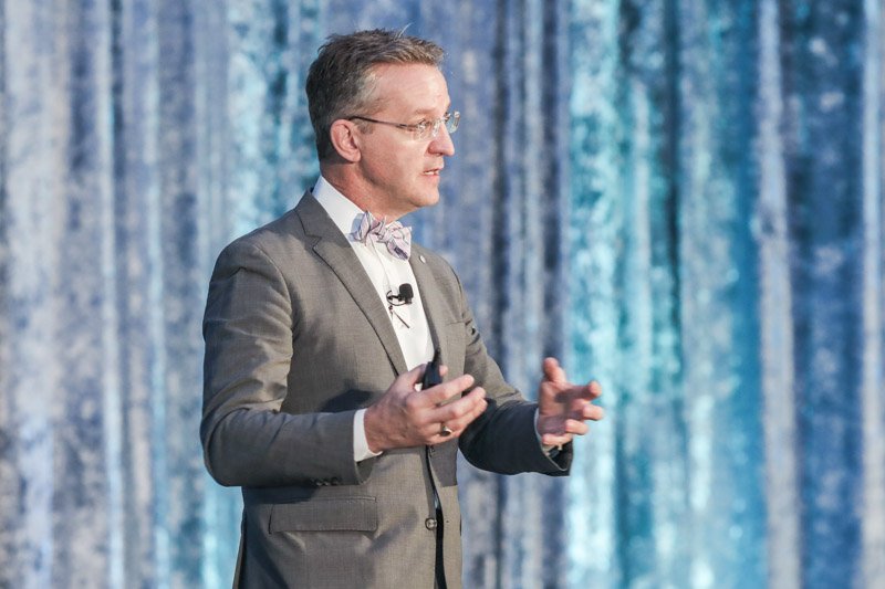 Keynote speaker presenting at a corporate conference at Huntington Place in Detroit photographed by a corporate event photographer