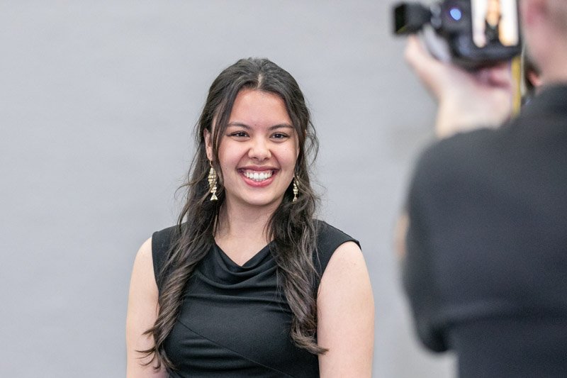 Attendee photographed during an on-site conference headshot activation