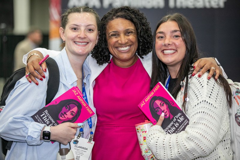 Attendees posing during a conference event in Metro Detroit