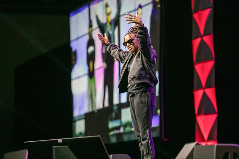 Speaker presenting during a conference keynote session
