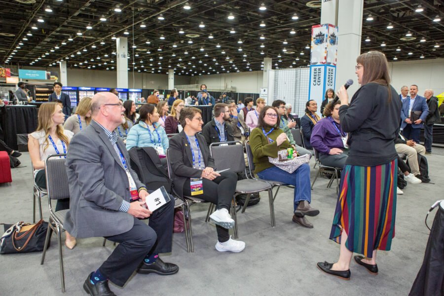 Conference attendees participating in a professional development session