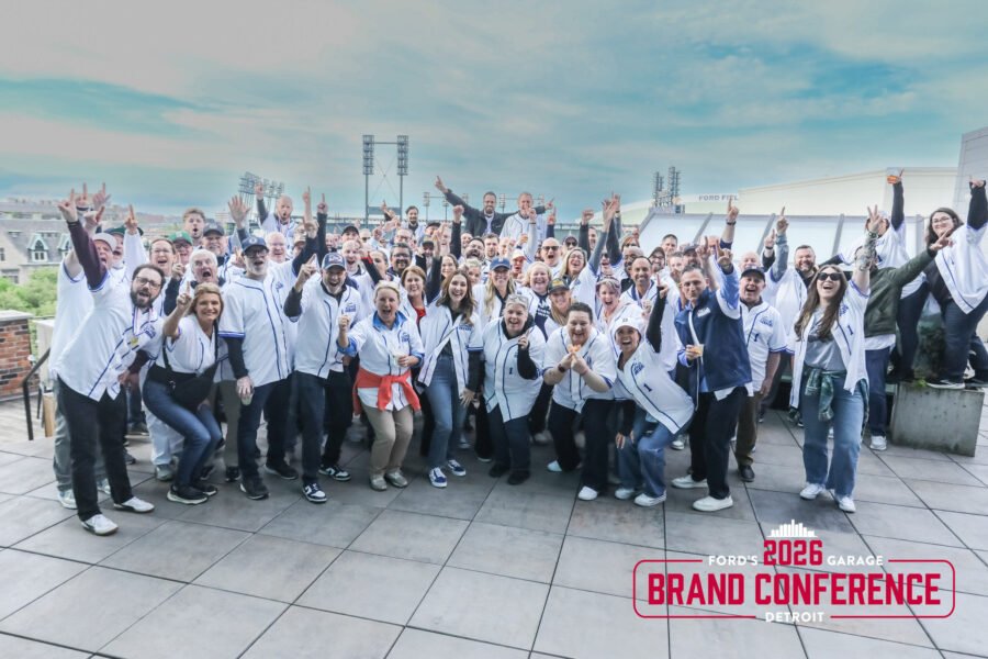 Conference attendees celebrating during a corporate event in Detroit