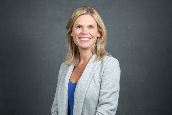 Professional LinkedIn headshot created at a corporate event.