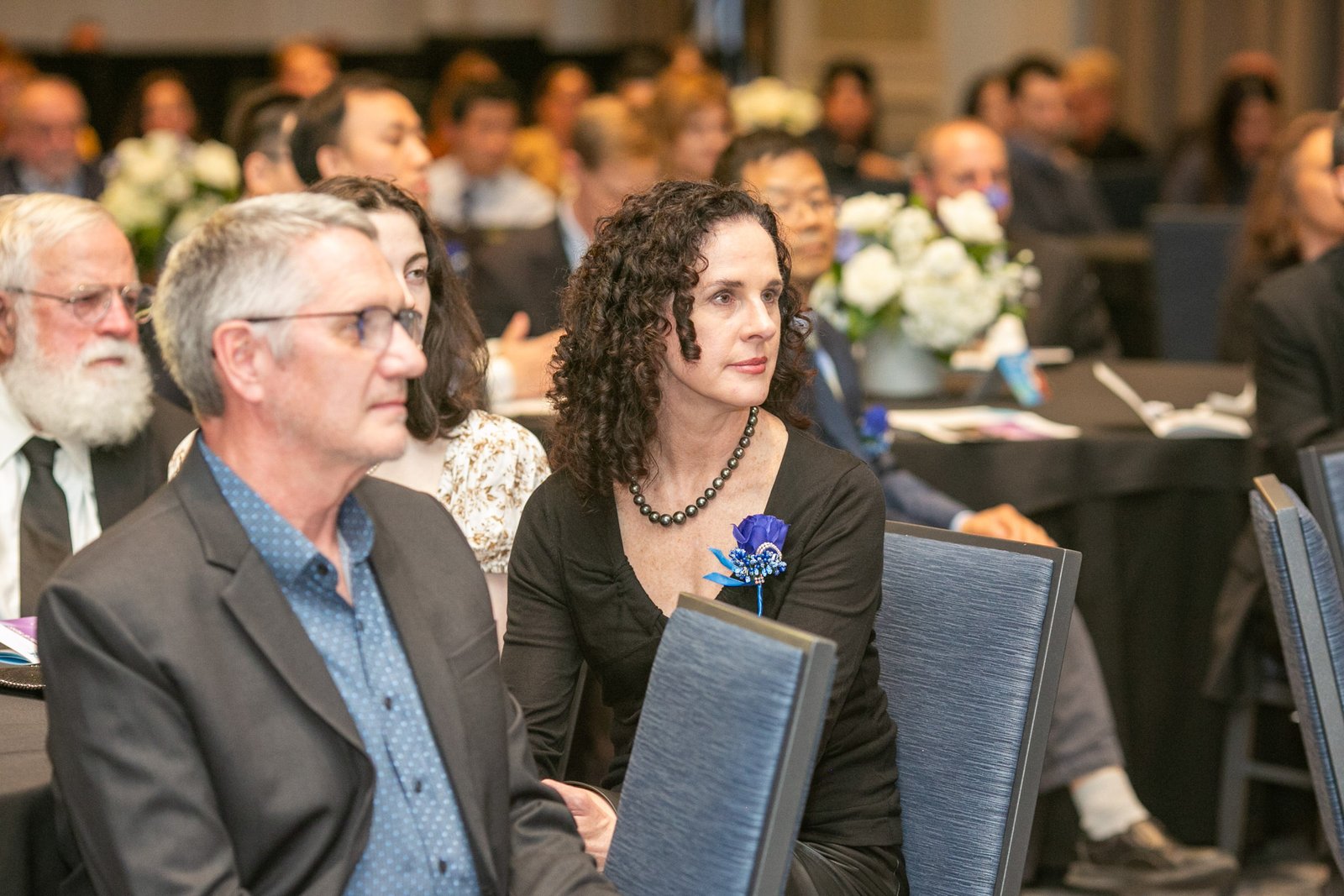 Attendees listening to presentations during the SAE Fellows Reception and Dinner at The Westin Book Cadillac.