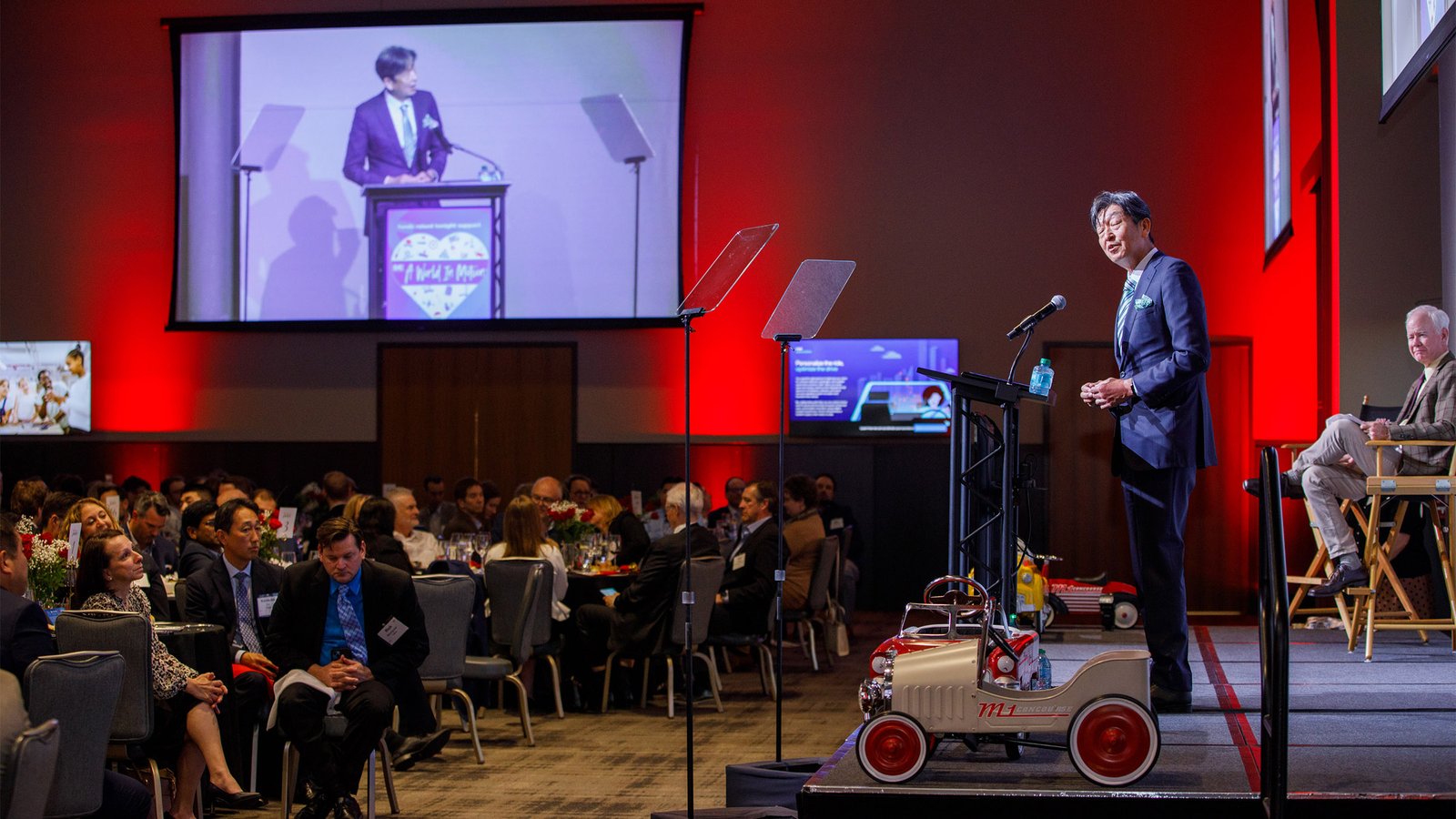 Executive keynote speaker presenting to attendees during a corporate conference in Metro Detroit. Mobile