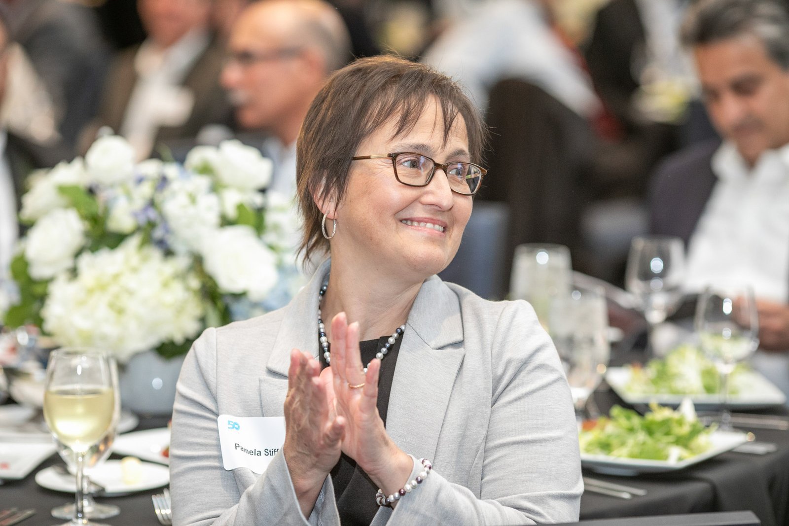 Guest applauding during the SAE Fellows Reception and Dinner at The Westin Book Cadillac.