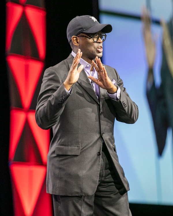 Keynote speaker presenting during a corporate conference in Metro Detroit.
