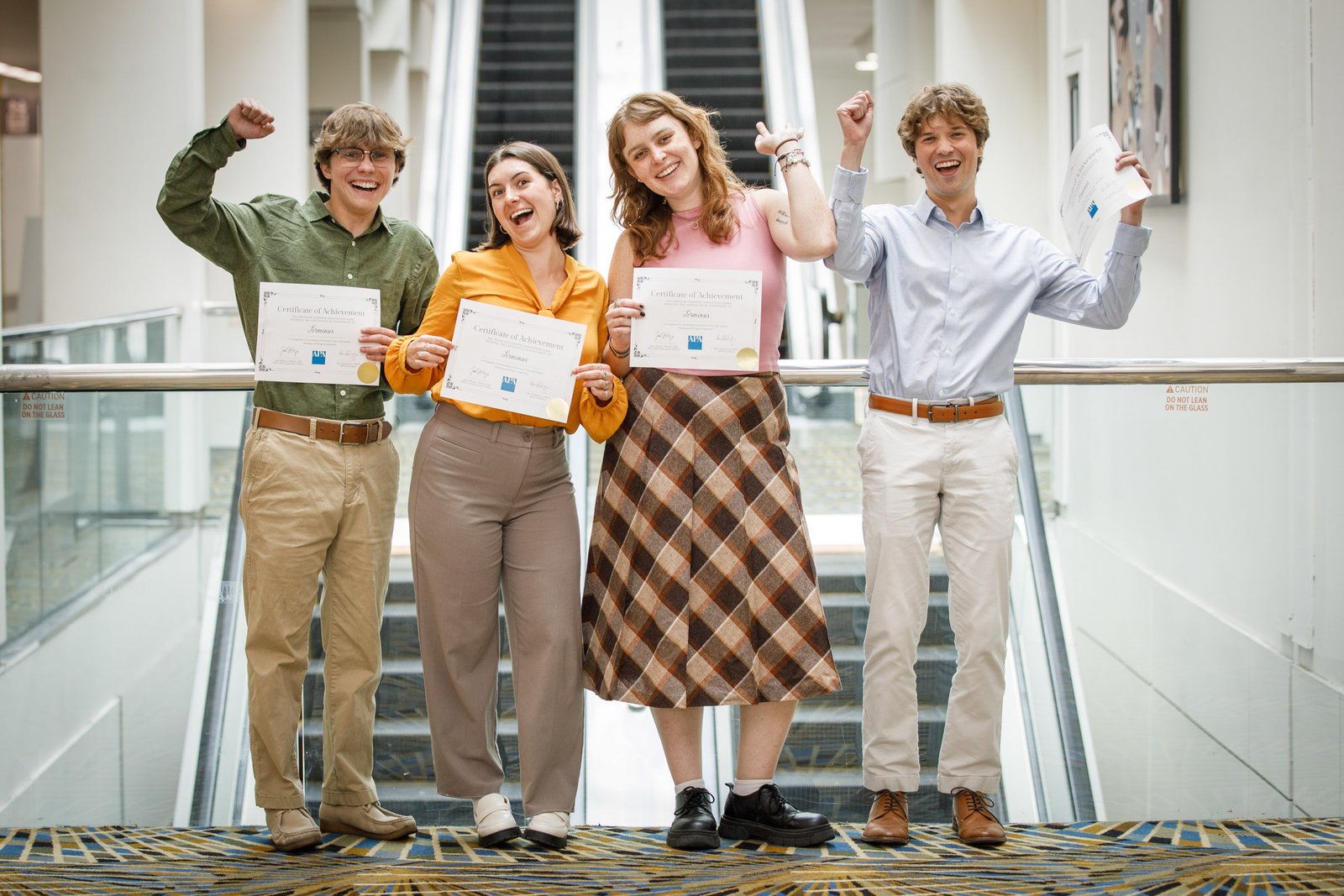 Conference participants celebrating with certificates during the APA National Planning Conference (NPC26) at Huntington Place in Detroit