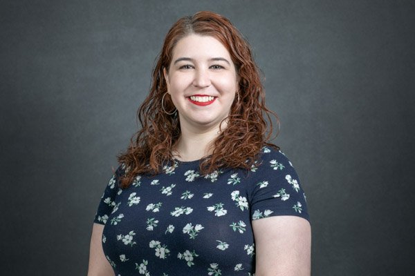 Corporate attendee photographed during an on-site LinkedIn headshot clinic.