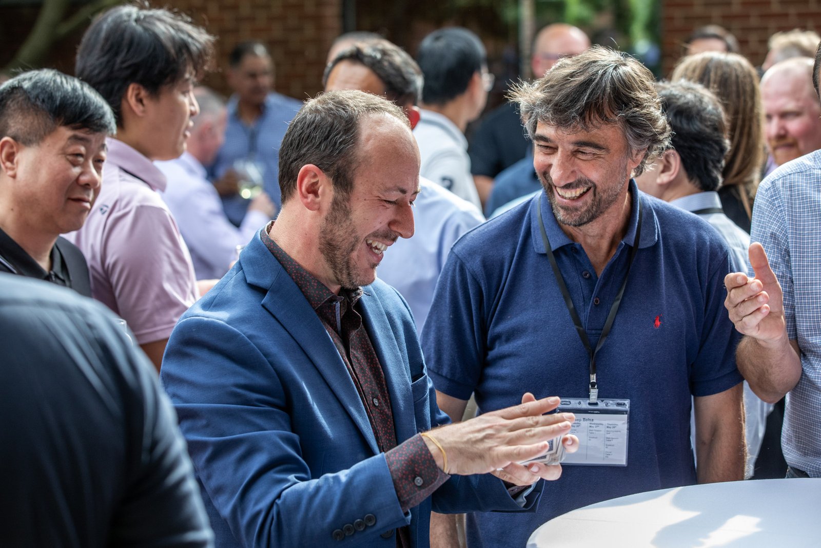 Conference attendees networking during a corporate event at Saint John's Resort in Plymouth, Michigan.