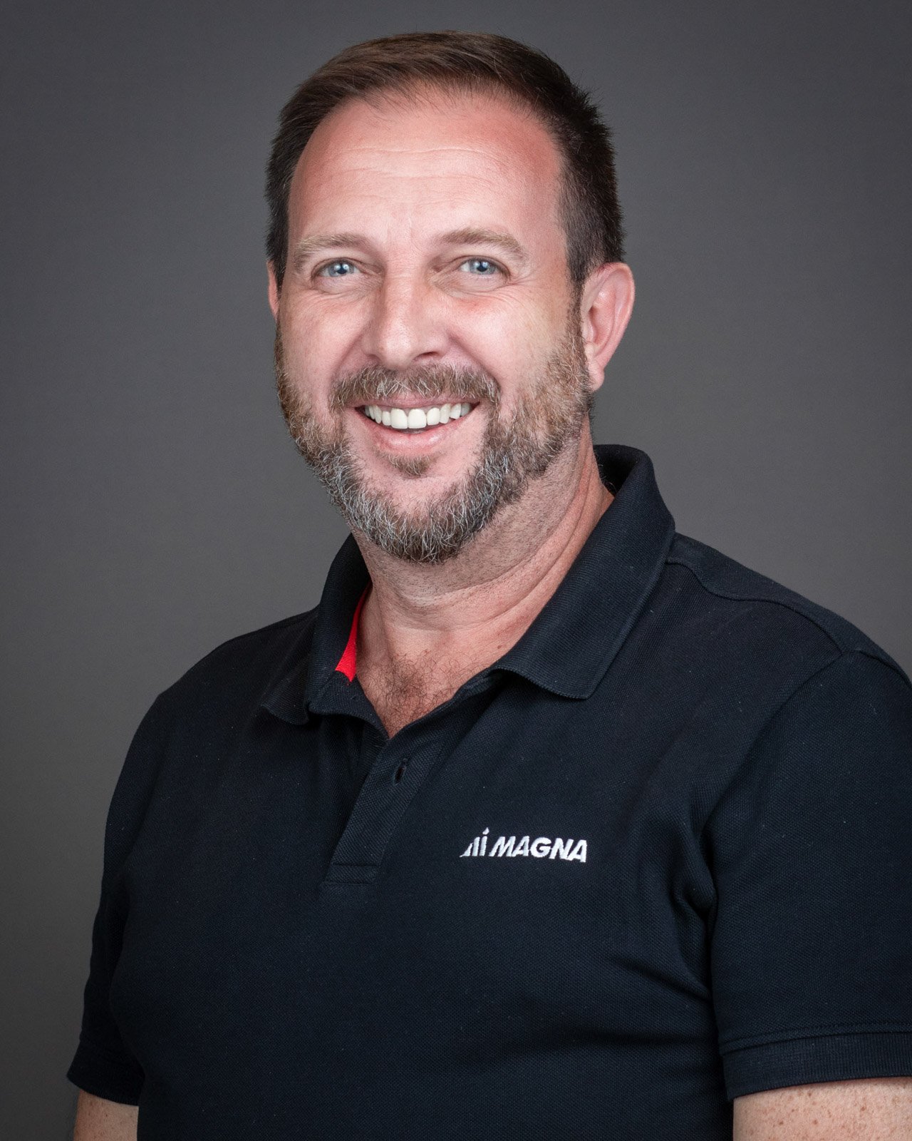 Professional corporate team headshot photographed on-site for Magna Seating in Troy, Michigan.