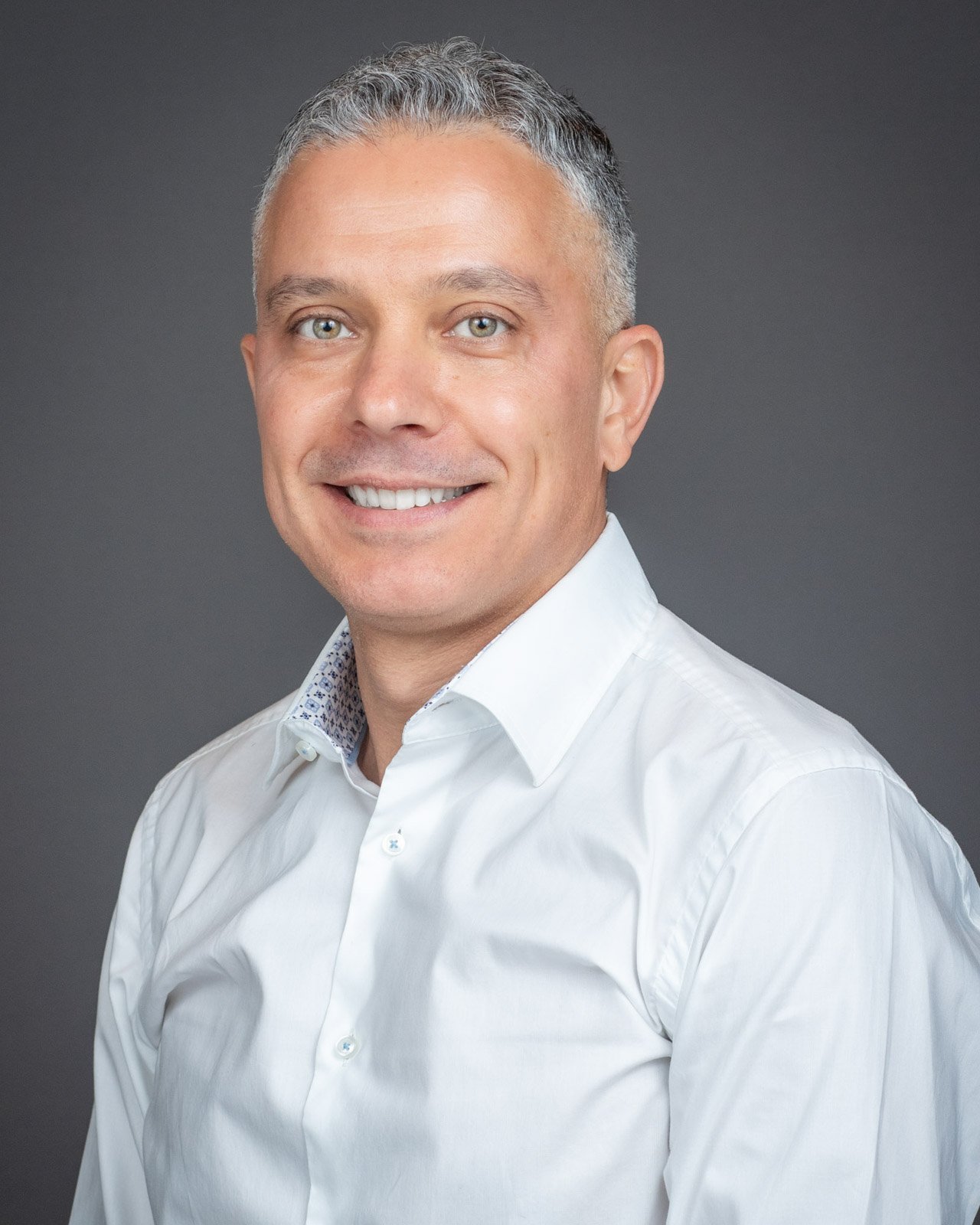 Professional corporate team headshot photographed on-site for Magna Seating in Troy, Michigan