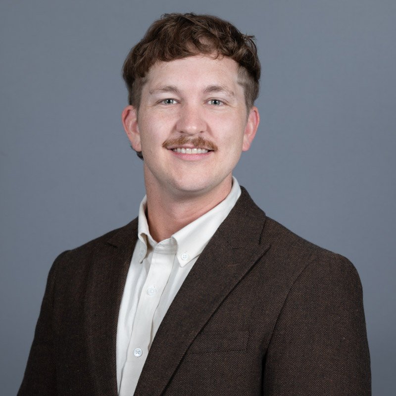 Male employee corporate headshot photographed on-site for RouteOne