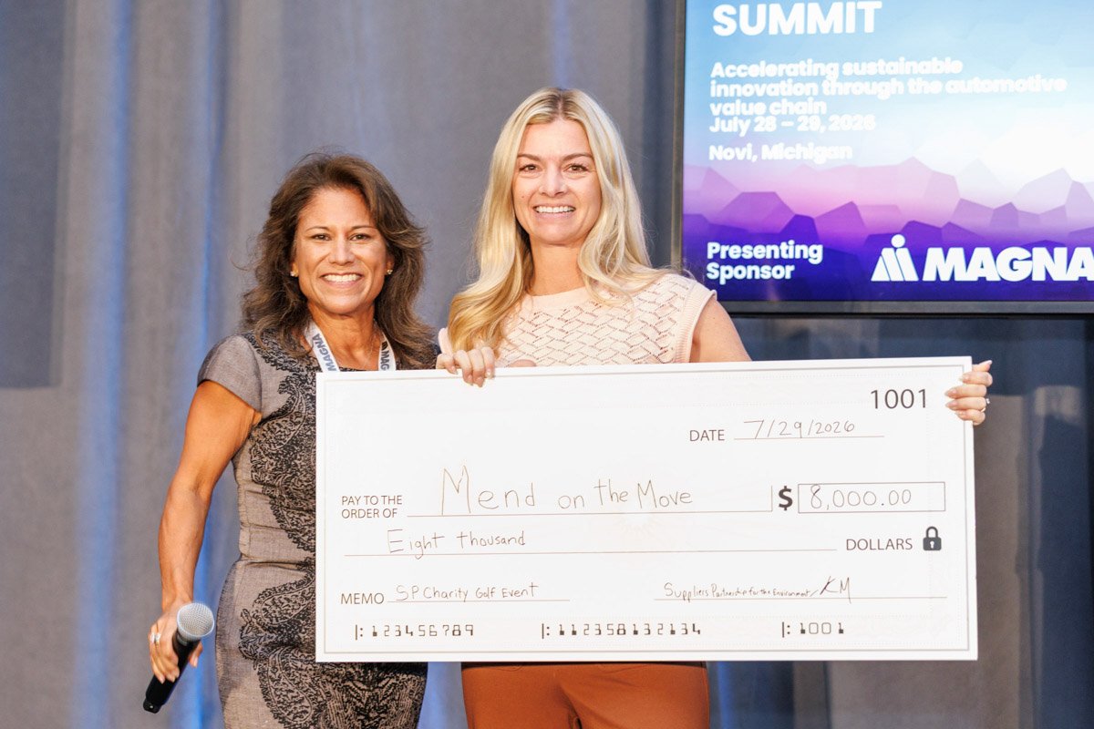 Charity donation presentation during the Suppliers Partnership for the Environment Innovation Summit at Vibe Credit Union Showplace in Novi, Michigan.