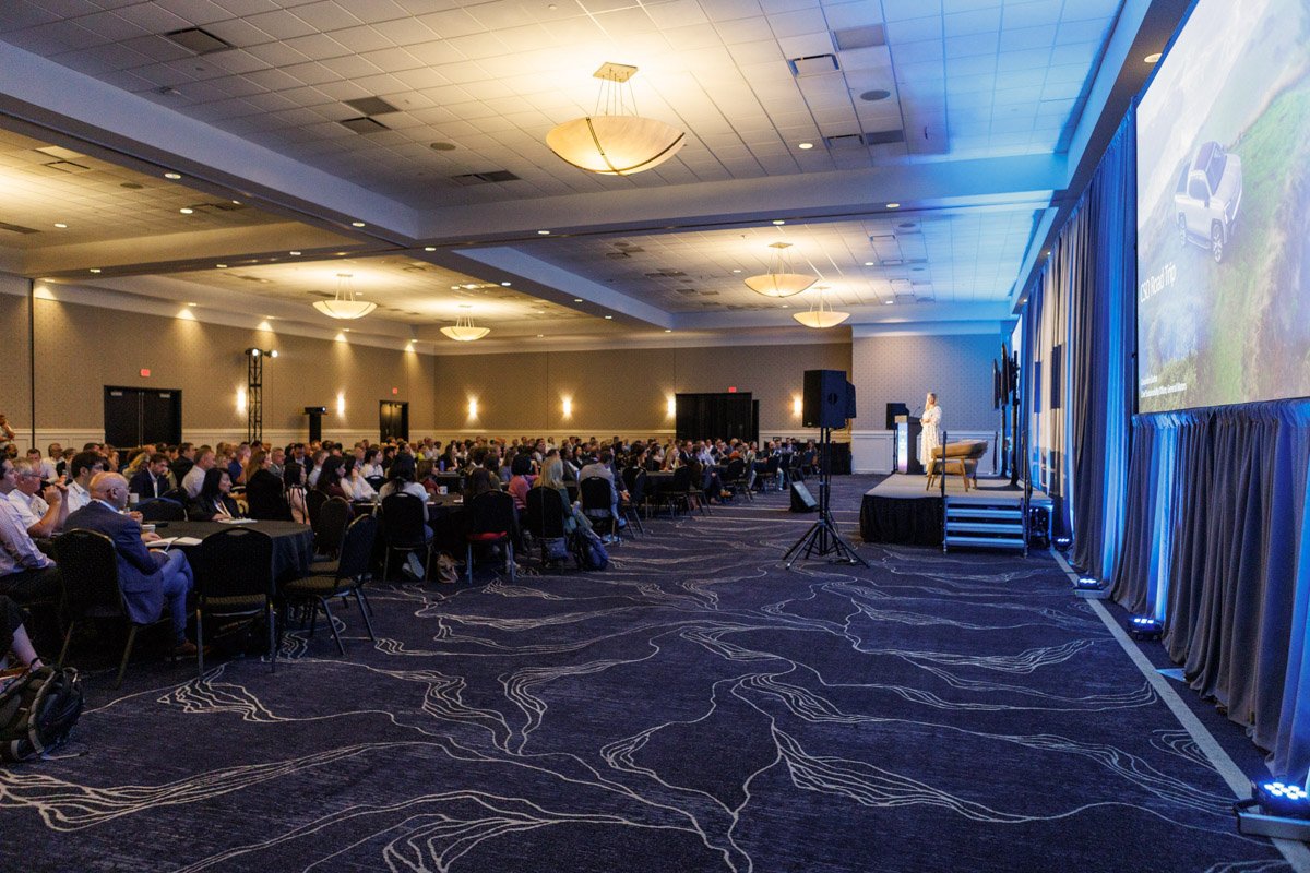 General session and keynote audience at Vibe Credit Union Showplace during a corporate conference in Novi, Michigan.