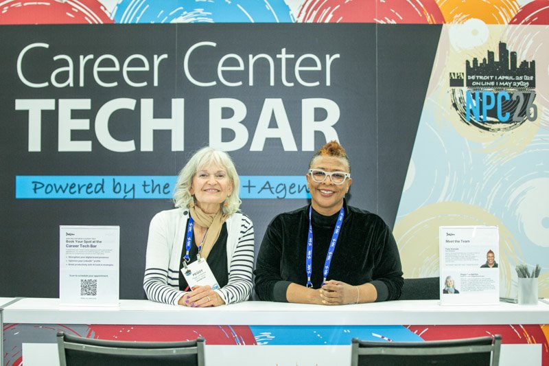 Attendees receiving assistance at the Career Center Tech Bar on the convention floor