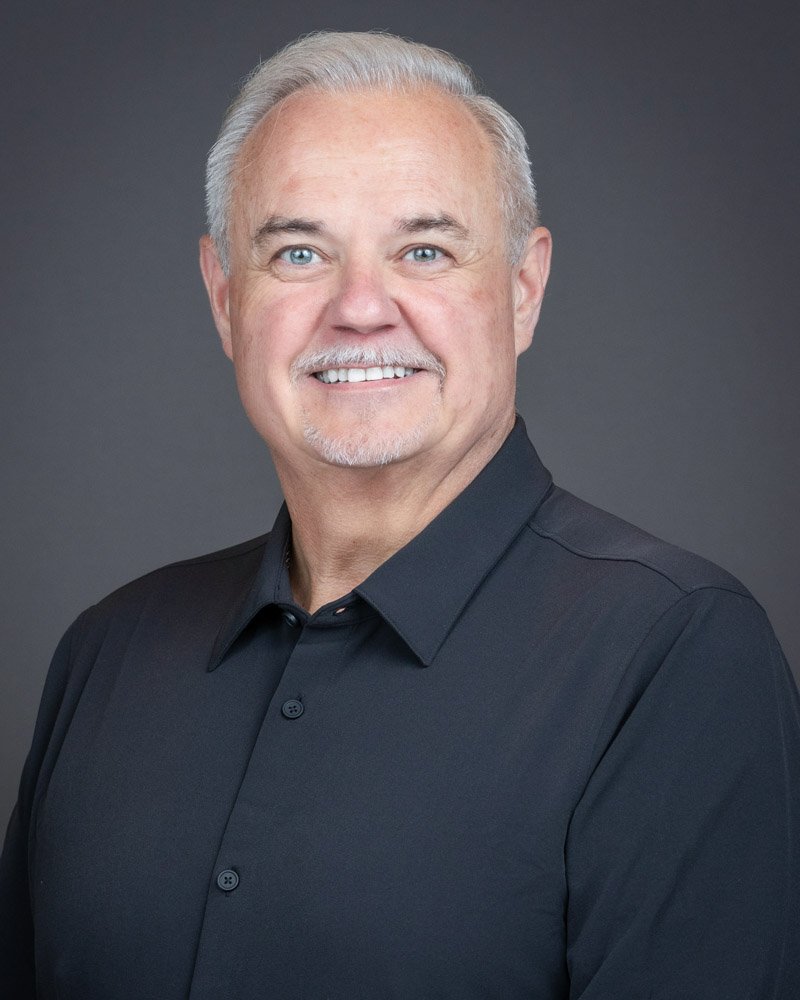 Professional corporate headshot photographed on-site for Magna