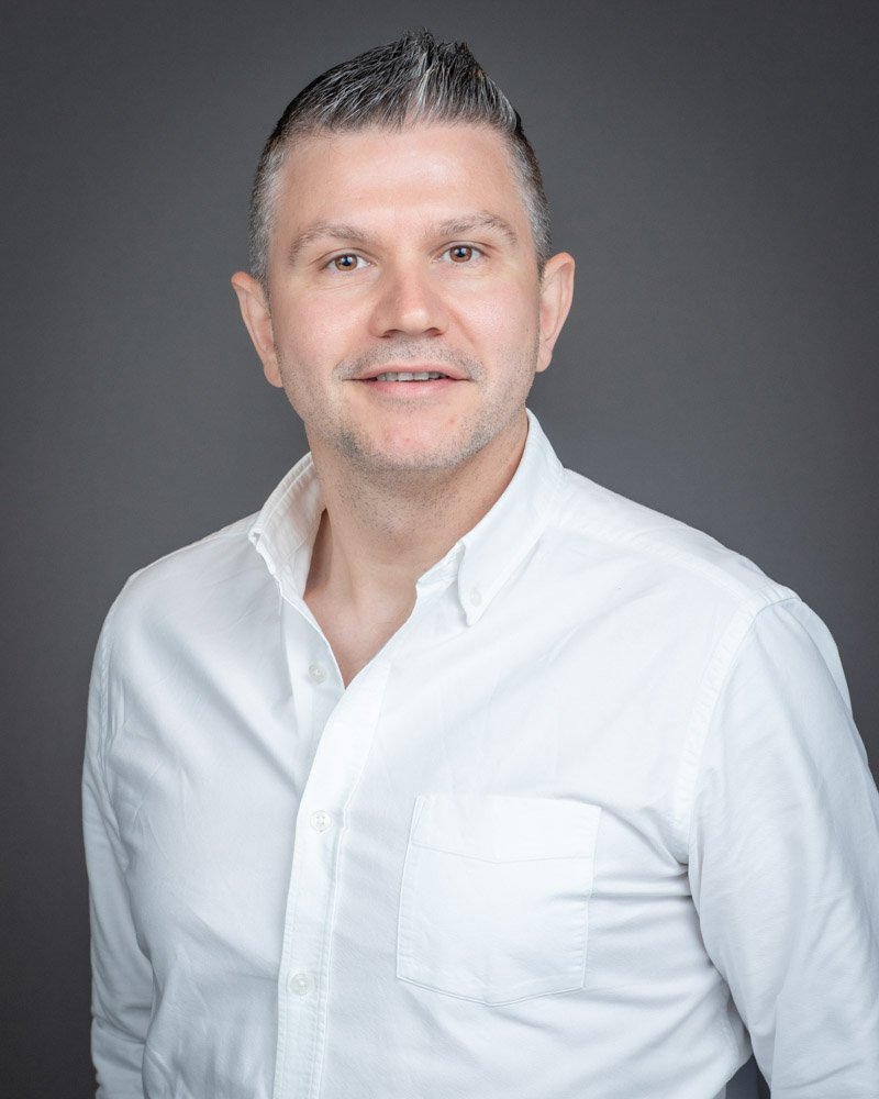 Professional employee headshot created during a Magna on-site headshot program