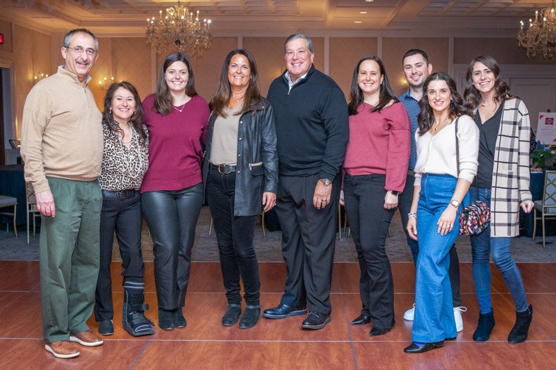 Corporate event group photographed in the ballroom at The Townsend Hotel